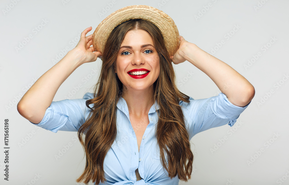 Portrait of smiling girl touching her mexican hat.