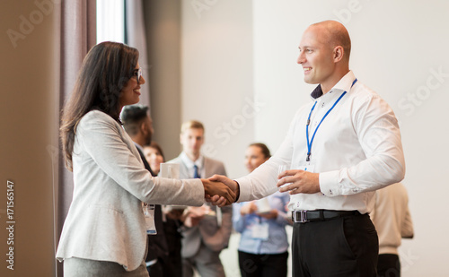 handshake of people at business conference