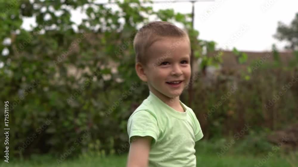 little boy waves his hands joyfully. Slow motion little boy waves his hands joyfully. Slow motion
