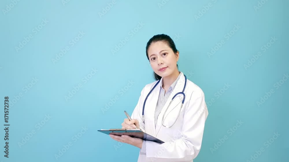 pleasantly female clinic doctor holding board pleasantly female clinic doctor holding board