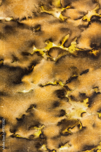 Braun, fleckig - abstraktes Muster auf gealtertem, verblassten retro Buchumschlag photo