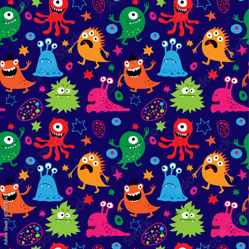 Seamless pattern with cute aliens on a blue background