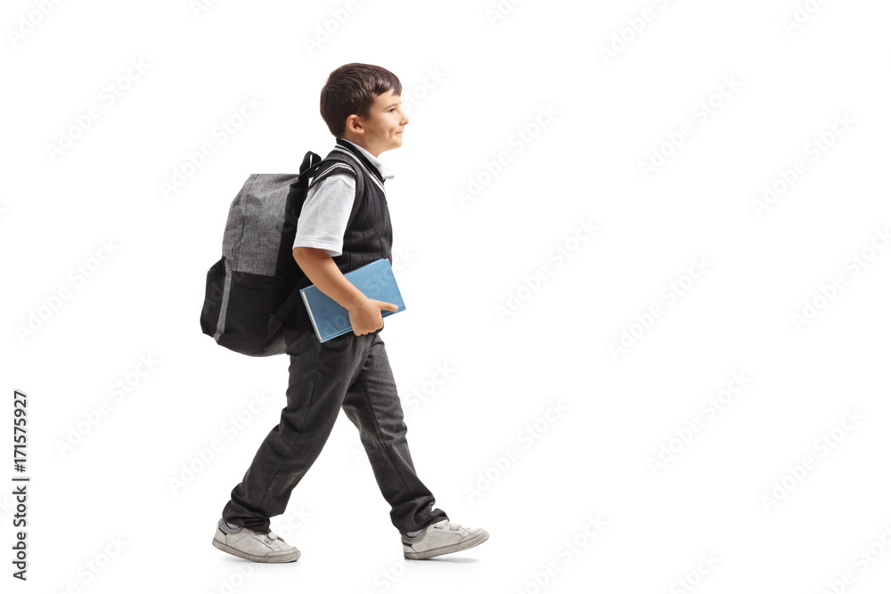 Schoolboy with a backpack walking Schoolboy with a backpack walking