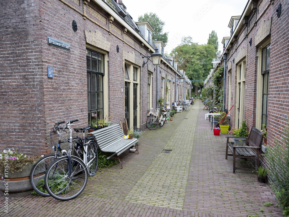 narrow street with small houses in centre of dutch town utrecht in holland