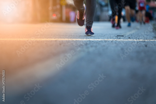 Blurred Legs of people on marathon running. Run for health.