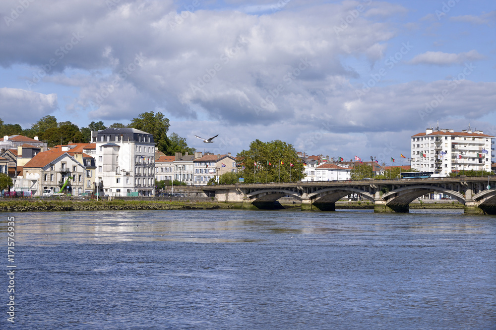 Adour River and Saint-Esprit bridge at Bayonne, commune in the Gironde department in southwestern France.