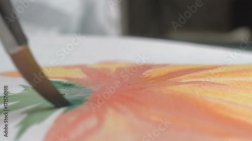 Artist painting watercolor paints