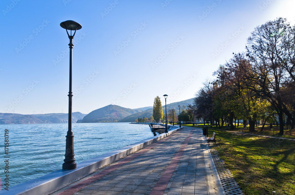 Danube river wide like a sea in front of Djerdap gorge entrance, a view from promenade at city of Golubac in Serbia