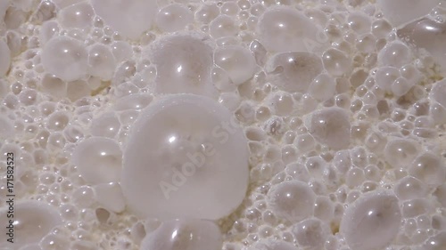 Fermentation process of yeast at the factory for baking bread macro. Ripe sourdough yeast ferments in a vat. Fermentation of yeast ferment close-up at the factory. Bread Factory. photo