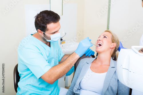 Adult woman getting her checkup at the Dentist