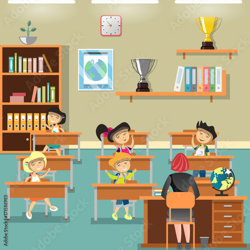 Children in classroom and raising hands