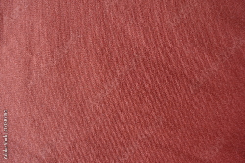 Coral colored simple jersey fabric from above