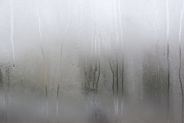 Window with condensate or steam after heavy rain, large texture or background
