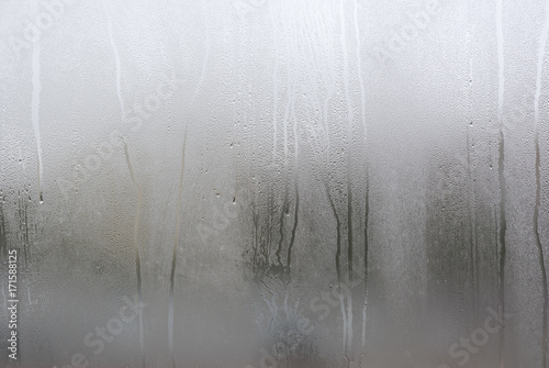 Fotografie, Obraz Window with condensate or steam after heavy rain, large texture or background