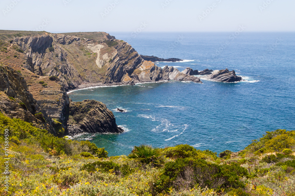 Cliffs, beach and waves in Arrifana