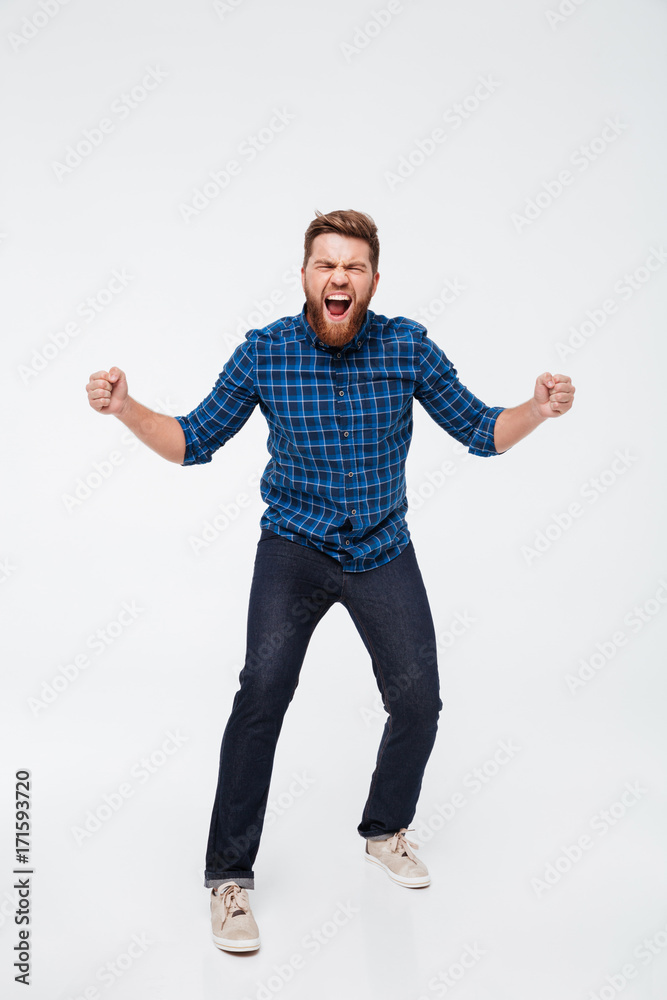 Full length portrait of a crazy bearded man screaming Full length portrait of a crazy bearded man screaming