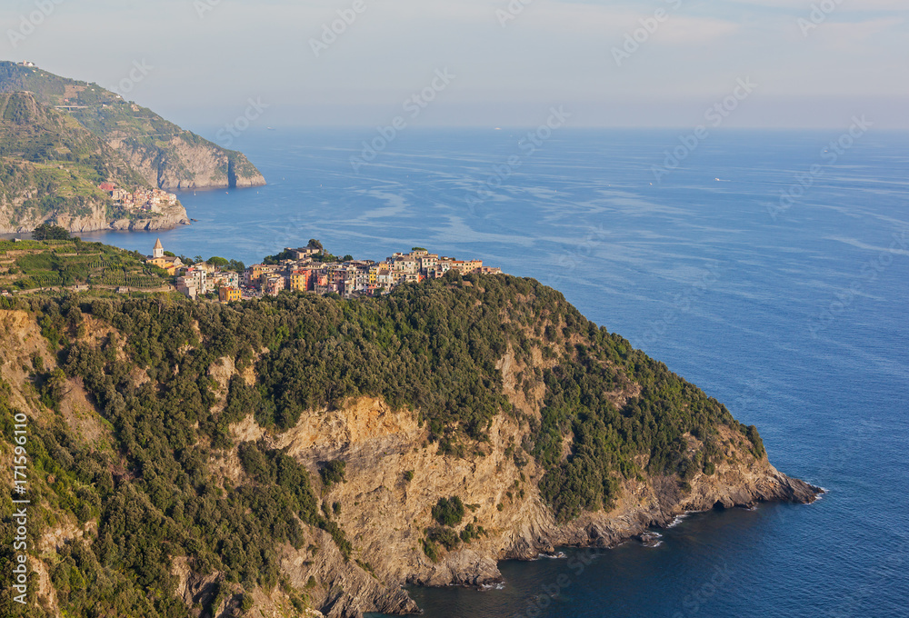 Panoramic view of steep cliffs of Liguria coastline with picturesque village of Cinque Terre National park, Italy