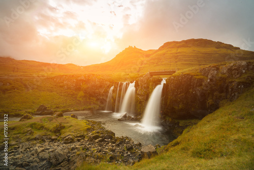Beautiful of Kirkjufellsfoss waterfall with Kirkjufell mountain in the background on the north  Iceland