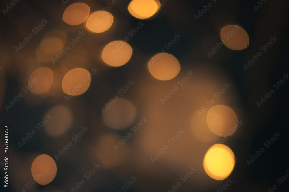Fototapeta premium Luxury Abstract Shining Party Background with Sparkling Lights and golden bokeh. Christmas Design. Colorful circles of dark nights defocussed background.
