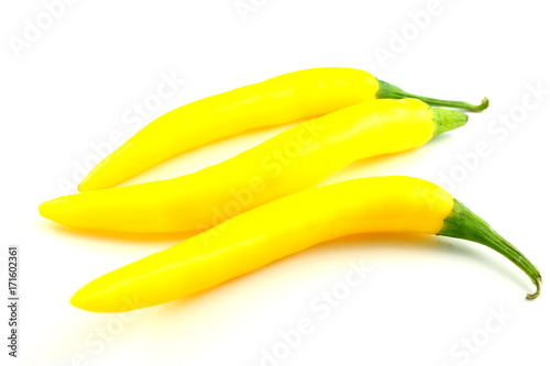 fresh yellow chili peppers isolated in a white background