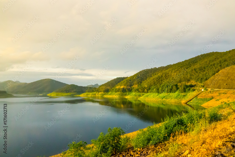 Lake and mountain before sunset. Landscape of lake and mountain background.