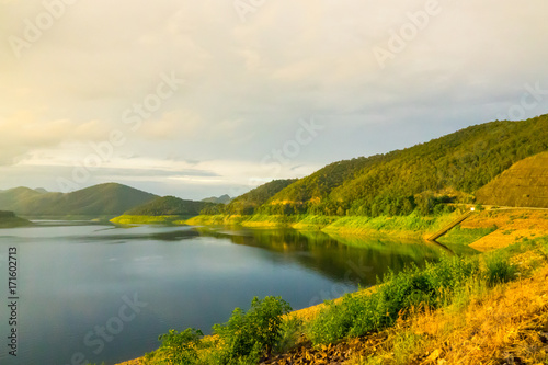 Lake and mountain before sunset. Landscape of lake and mountain background. © Golden House Images