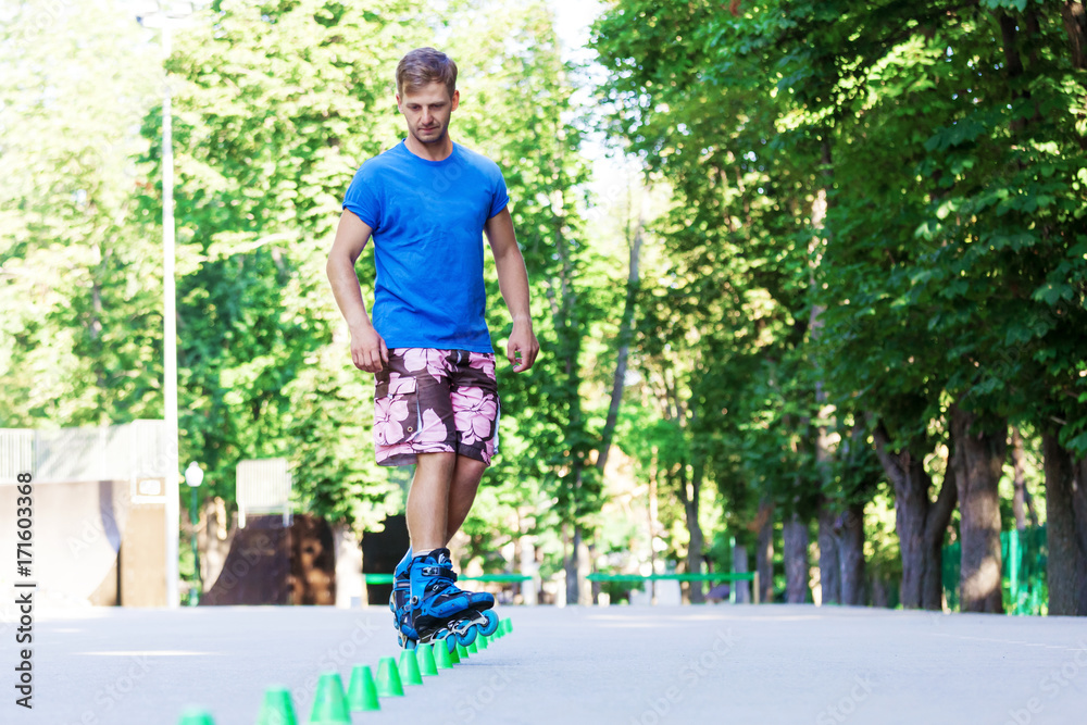 Inline roller skater on a slalom course Inline roller skater on a slalom course