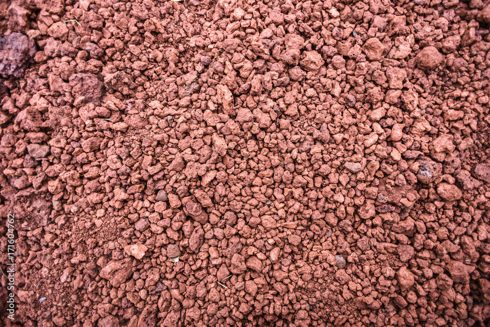 Texture of red stones of different size, brick color, Iceland Texture of red stones of different size, brick color, Iceland