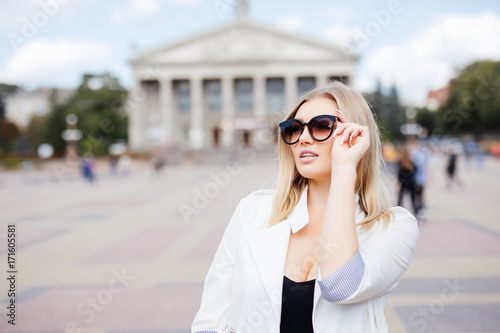 Young beautiful girl in stylish sunglasses in the city street. © F8  \ Suport Ukraine