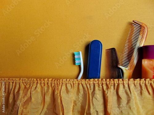 Retro suitcase with packed tooth brush, combs
