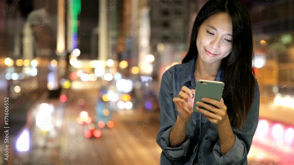 Young woman using smart phone at night Young woman using smart phone at night