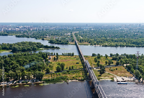 Aerial view of the Kiev (Kyiv) city, Ukraine. Dnieper river with bridges. Troeshchina district in the background