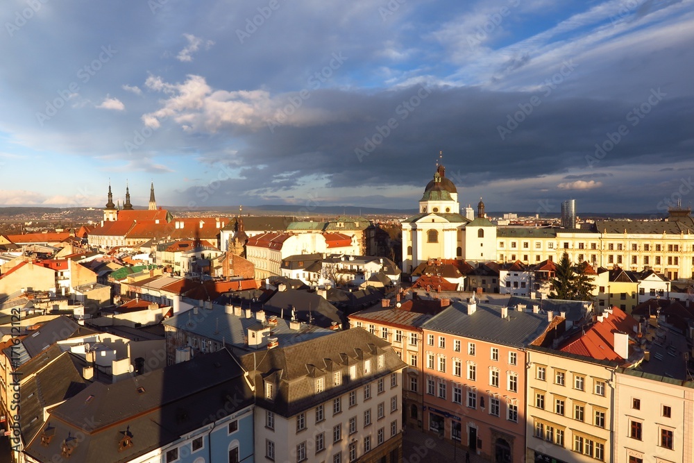 Olomouc, Czech Republic rooftop view of Baroque city under dramatic sky
