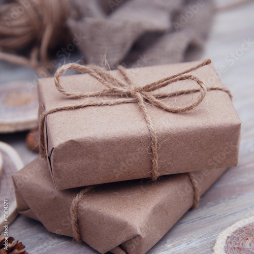 Christmas style rustic brown paper package tied up with strings
