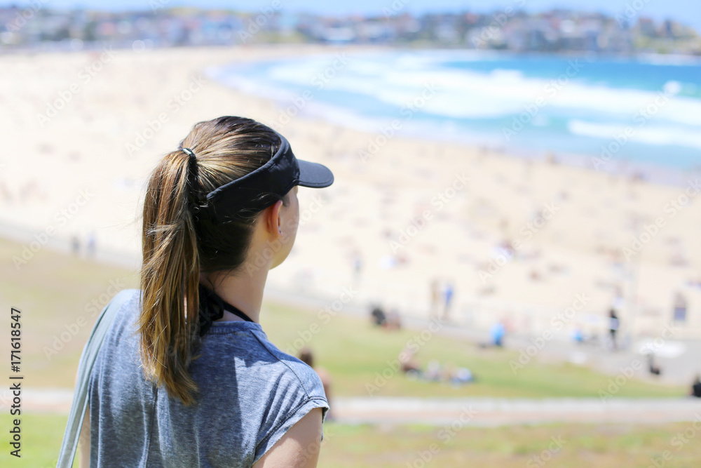 Woman looking at Bondi beach, Australia
