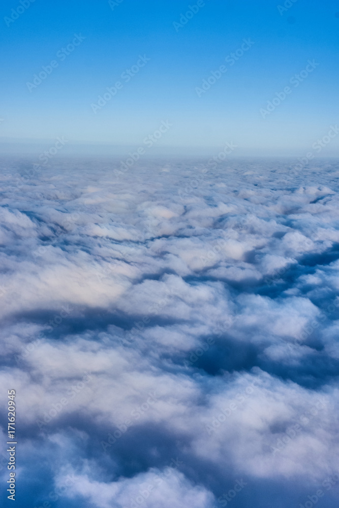 clouds and blue sky seen from airplane clouds and blue sky seen from airplane