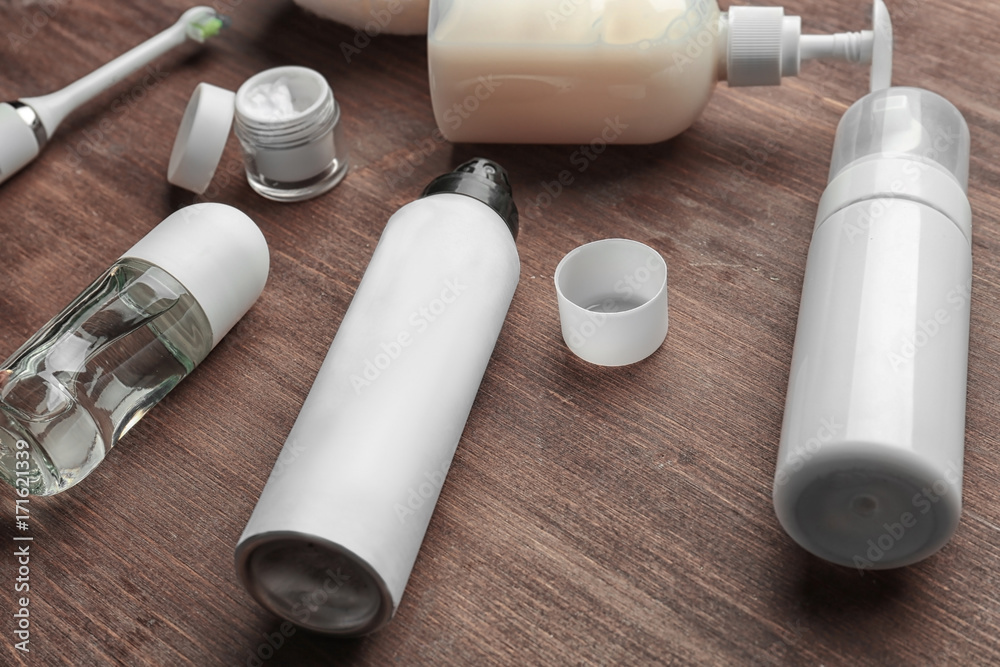 Set for personal care with deodorants on wooden table Set for personal care with deodorants on wooden table