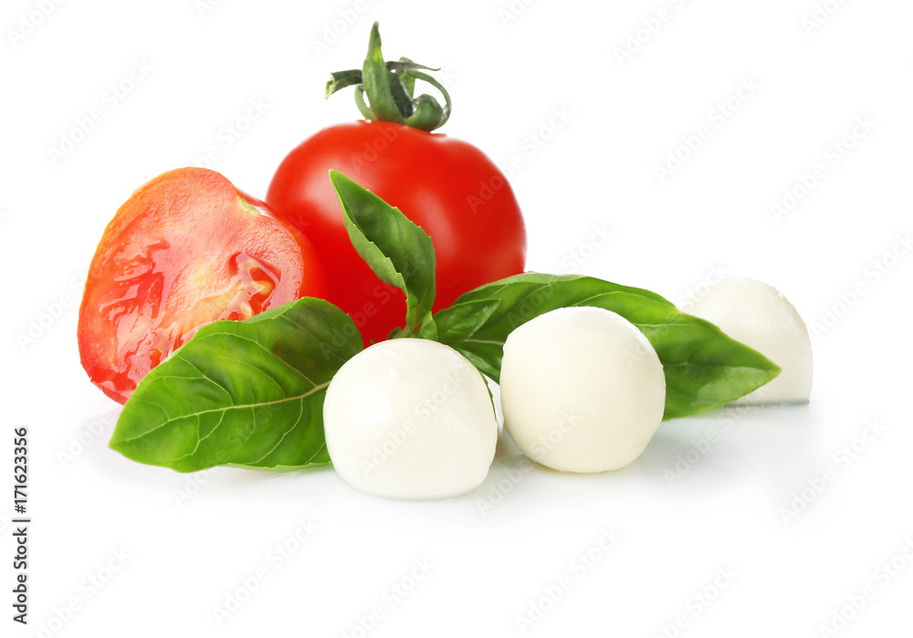Mozzarella cheese balls, cherry tomatoes and green fresh organic basil isolated on white Mozzarella cheese balls, cherry tomatoes and green fresh organic basil isolated on white