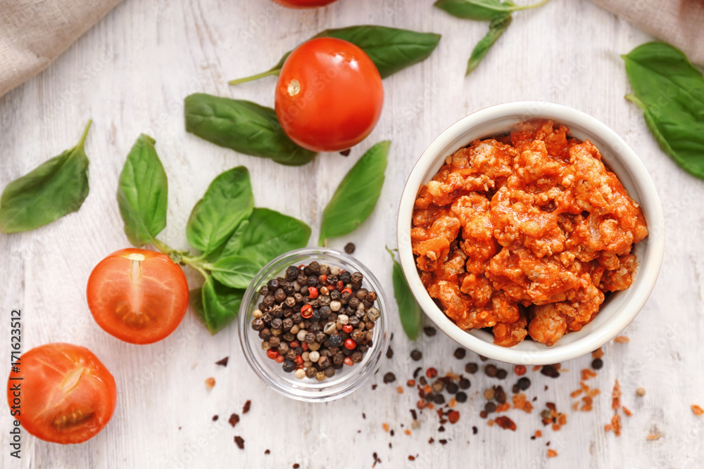 Meat sauce in ceramic bowl on kitchen table Meat sauce in ceramic bowl on kitchen table