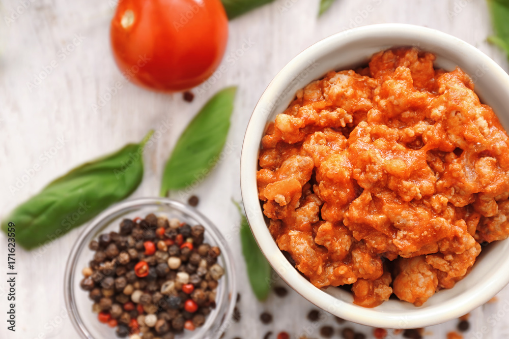 Meat sauce in ceramic bowl on kitchen table Meat sauce in ceramic bowl on kitchen table