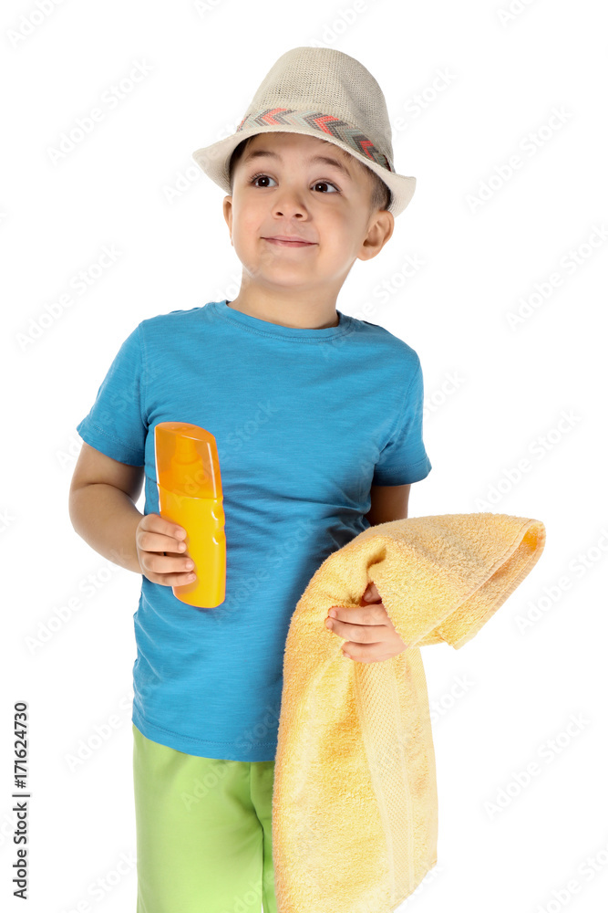 Cute little boy with sunscreen cream and towel on white background. Summer vacation concept Cute little boy with sunscreen cream and towel on white background. Summer vacation concept