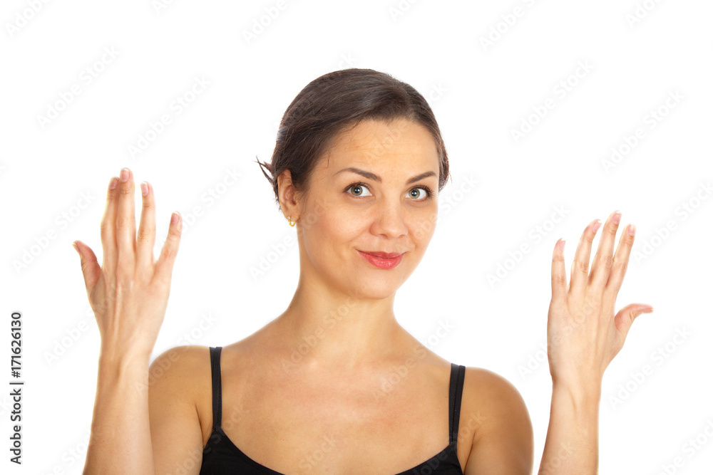 Young woman smiling and holding her hands up Young woman smiling and holding her hands up