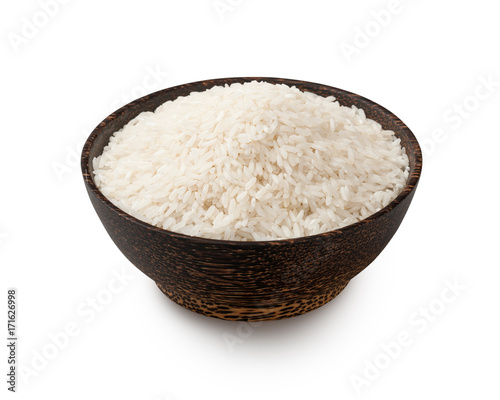 Uncooked white long grain rice in a bowl, isolated on white