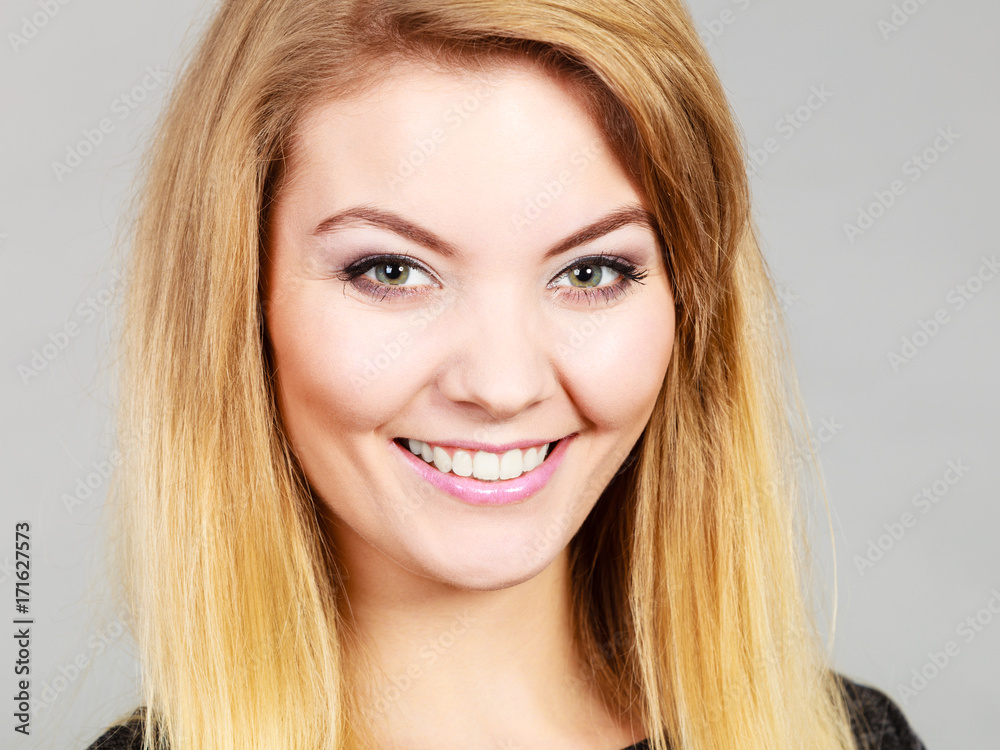 Portrait of happy blonde woman smiling with joy Portrait of happy blonde woman smiling with joy