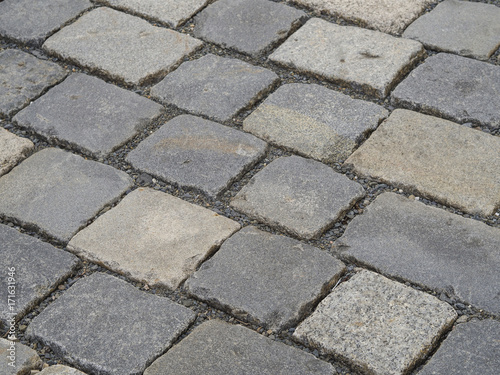 close up old town cobblestone gray paving stone square background