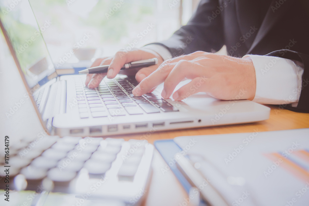 Businessman working with sheet analysis charts. Businessman working with sheet analysis charts.