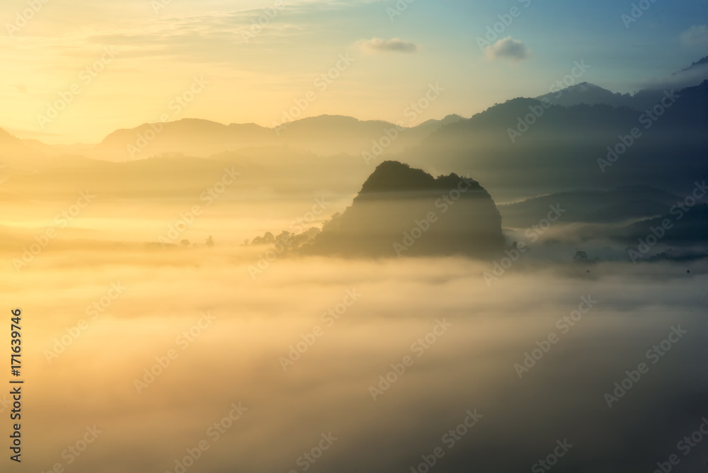 sunrise over fog and mountain in forest