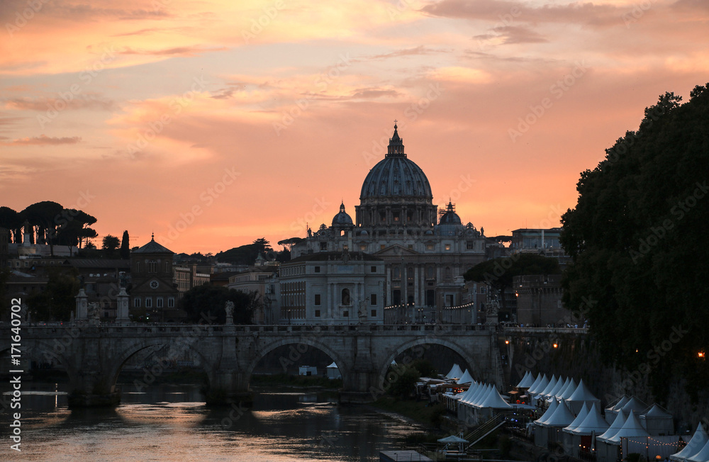 View of St. Peter's Basilica and the Tiber River at sunset, Rome, Italy