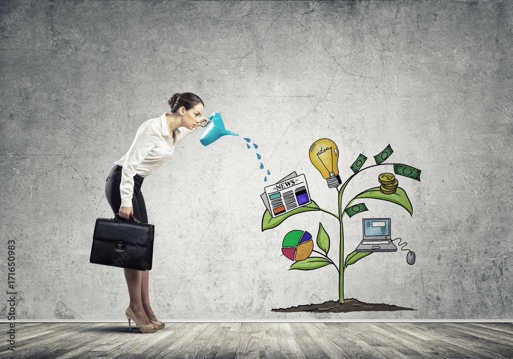Young businesswoman in empty room watering drawn growth concept with can Young businesswoman in empty room watering drawn growth concept with can