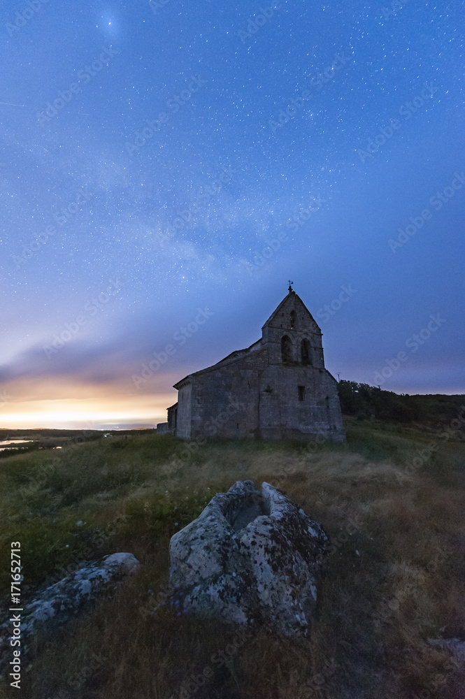 Starry night over a small church Starry night over a small church